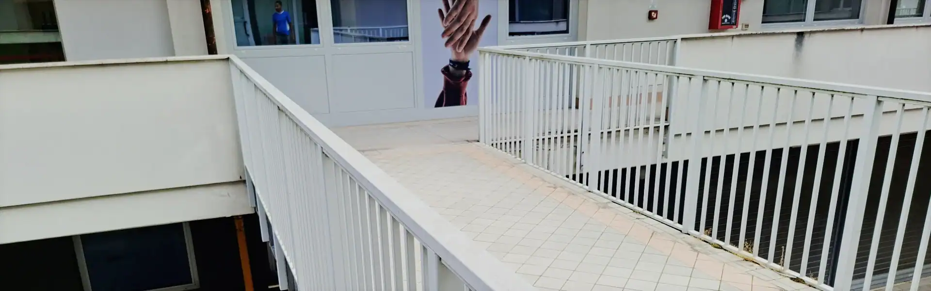 Outdoor connecting walkway at PadovaCampus student residence in Padua